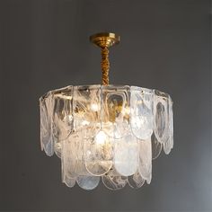 a chandelier with many glass pieces hanging from it