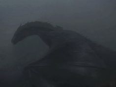 godzilla in the fog with its head turned to look like it's coming out of the water