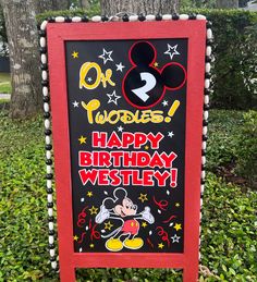 a birthday sign with mickey mouse on it