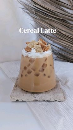 there is a drink with cereal in it on the table