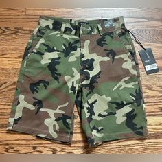 These Rvca Shorts Are Perfect For Any Young Boy Who Loves To Spend Time Outdoors. The Camouflage Pattern Blends In With The Natural Environment, While The Chino Style Offers A Comfortable And Casual Look. The Shorts Are Available In Size 26 And Have Never Been Worn, Making Them An Ideal Addition To Any Young Boy's Wardrobe. The Shorts Are Made From High-Quality Materials And Are Designed To Withstand The Wear And Tear Of Everyday Use. They Are Perfect For Weekend Adventures Or Daily Playtime. Wi Summer Cotton Bottoms For Skateboarding, Camouflage Military Cotton Shorts, Military Camouflage Cotton Shorts, Camouflage Cotton Shorts For Outdoor, Casual Cotton Shorts For Skateboarding, Casual Short Bottoms For Skateboarding, Casual Camouflage Cotton Shorts, Casual Cotton Bottoms For Skateboarding, Green Chinos