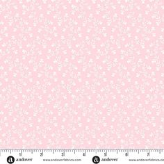 a ruler with a pink background and white flowers on it