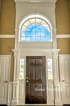 a large wooden door sitting inside of a building