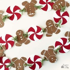 gingerbread paper garlands with candy canes on them