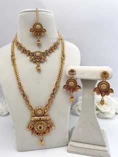 Matt gold finish necklace and Raani Haar(long necklace) comes with Earrings and tikka/bridal jewellery/south Indian long necklace Set/Rajwadi Rani Haar/Guttapusalu necklace/ gold plated bridal sets Bridal /Indian Wedding jewelry/bridal jewelry/ Indian jewelry /Kundan Jewelry/Kundan pearl choker/ Punjabi necklace/ Pakistani jewelry/High quality Indian Jewelry All items are shipped from Brampton, Ontario, Canada. If you need your item by a certain day, please reach out to us for express delivery option. We kindly request to consider minor variations in colors, shades, textures as pictures displayed may slightly vary from the actual product due to digital image limitations. Please expect the possibility of some minor imperfections when buying handmade jewelry. Please contact us for any questi Rani Haar Gold Jewellery Designs, Gold Long Rani Haar Designs, Guttapusalu Necklace Gold, Gold Rani Haar Indian, Gold Necklace Rani Haar, Rajwadi Jewellery, Rani Haar Gold, Rani Haar Long Necklaces, Jewellery South Indian