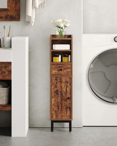 a washer and dryer in a bathroom next to each other