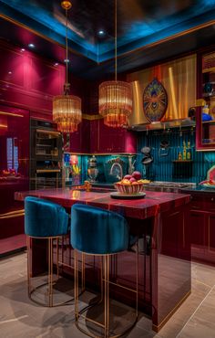 a kitchen with red cabinets and blue stools next to a counter top in the center