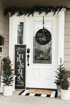 the front door of a house decorated for christmas