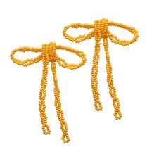 Prepare for compliments with our Gracie Beaded Bow Earrings. Each earring is hand-strung with glass beads in the color of your choice. These statement earrings add the perfect feminine touch to everyday wear or a special-occasion ensemble. Elegant Yellow Beaded Earrings, Elegant Adjustable Beaded Earrings With Beaded Chain, Elegant Beaded Chain Earrings As Gift, Elegant Beaded Chain Earrings For Gift, Elegant Yellow Beaded Earrings With Gold Beads, Elegant Adjustable Beaded Earrings, Elegant Adjustable Beaded Earrings With Colorful Beads, Elegant Adjustable Colorful Beaded Earrings, Elegant Yellow Beaded Earrings For Gift