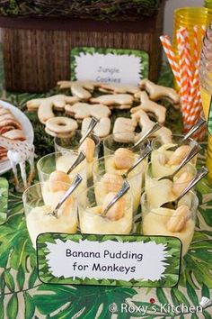 banana puddings for monkeys are served in small cups with toothpicks on them