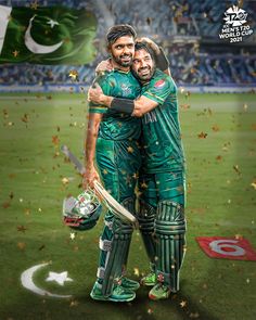 two pakistan cricket players hugging each other on the field with confetti falling around them