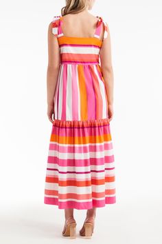 Be summer ready in the stylish and seasonally appropriate Bridget Tie Dress! This striped, color block maxi dress features bright pink and orange tones and bow tie straps, making it an effortless, eye-catching staple of your summer wardrobe. Get ready for the season in this sweet look! For this dress, we recommend purchasing one size larger than you would normally wear! Pink Vertical Striped Summer Dress, Pink Vertical Stripe Summer Dress, Spring Dresses With Vertical Stripes In Multicolor, Spring Multicolor Striped Dresses, Striped Maxi Dress With Vertical Stripes For The Beach, Summer Striped Maxi Dress, Striped Maxi Dress For The Beach, Striped Maxi Dress For Summer, Summer Dresses With Vertical Stripes For Vacation