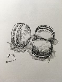 a pencil drawing of three macaroons sitting on the ground next to each other