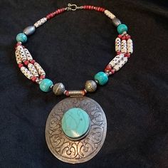 Vintage, Bohemian Boho style, Chunky Faux Turquoise Concho Pendant with Turquoise beads, carved bone beads and silver plated beads.  This chunky necklace/chocker is just beautiful, the Turquoise in the pendant I'm fairly sure isn't real but a type of early plastic, the silver plate has worn off some of the beads to reveal a type of brass underneath.  Lovely big clasp on it. 55.5 cms long All items are sold as is and with all Vintage items please be aware that some items may come with some wear a Bohemian Silver Turquoise Necklace For Festivals, Silver Bohemian Turquoise Necklace For Festivals, Bohemian Turquoise Necklace With Natural Stones For Festivals, Bohemian Turquoise Necklace For Festivals, Bohemian Turquoise Necklace With Silver Beads, Bohemian Turquoise Beaded Necklaces For Festivals, Turquoise Bohemian Beaded Necklaces For Festivals, Traditional Turquoise Necklace With Silver Beads, Tibetan Necklace