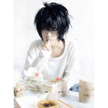 a woman with black hair sitting at a table in front of desserts and drinks