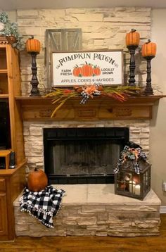 a fireplace decorated for fall with pumpkins and plaid napkins on the mantel