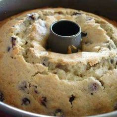 a bundt cake in a metal pan with a black ring on the top that is filled with chocolate chips