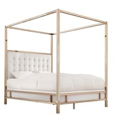 a white bed with a metal frame and headboard is shown against a white background