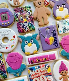 decorated cookies are displayed on a table