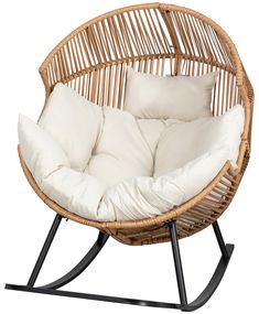 a wicker chair with white pillows on it