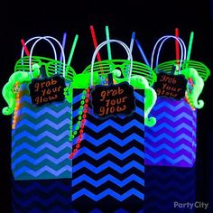 glow in the dark treat bags with name tags and neon straws on each bag