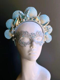 The mermaid crown headband boasts a captivating shade of turquoise that evokes the tranquil depths of the sea. Delicate pearls and sea shell details adorn the crown, adding a touch of oceanic charm and grace. Golden accents add an opulent touch, mirroring the treasures of the sea. This enchanting pairing ensures you'll be the center of attention at masquerade events!


Age Group/Gender - Adult/Women

Size/Type - One size fits all adults

Color - Turquoise/Gold/Silver

Mask Material - Lace

Accen Mermaid Mask, Labyrinth Ball, Pearl Mask, Silver Mask, Arts And Crafts For Adults, Mermaid Crown, Rainbow Magic, Sea Inspired, Masks Masquerade