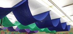 colorful paper streamers hang from the ceiling