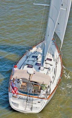 an aerial view of a sailboat in the water