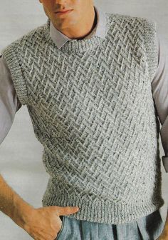 a man wearing a sweater vest and tie