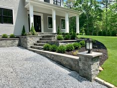 a house with stone steps leading up to the front door