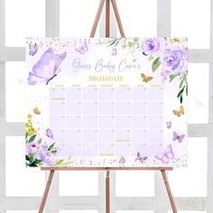 an easer with a calendar on it and purple flowers in the middle, against a white background