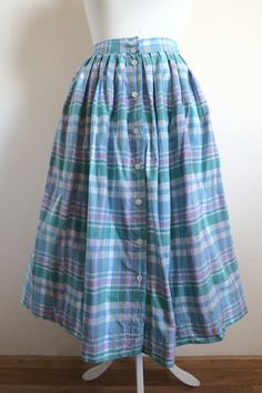 "Vintage checked cotton skirt in shades of blue, teal green and purple. High waist full pleated style. Buttons down the front. Midi length. Got side pockets. No lining. Estimated size larger Small. Please check the measurements: waist  ~ 72 cm  /  ~ 28 \" length  ~ 75 cm  /  ~  29.5 \" In great vintage condition. Top button missing." High Waist Blue Patchwork Skirt, Blue Patchwork Relaxed Fit Skirt, Cottagecore Skirt, Vintage Plaid Full Skirt, 1970s Plaid Skirt, Vintage Plaid Cotton Skirt, Beautiful Skirts, Cotton Skirt, Pleated Midi Skirt