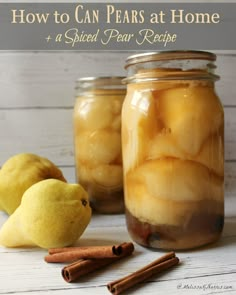 jars filled with pickled pears and cinnamon sticks