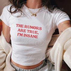 The Rumors Are True Im Insane Y2K Babytee, Tops With Funny Text, Joke Y2K Aesthetics, Sassy Sarcasm Gift, Teenager Babytee, Y2Kbaby Tee Heavy Cotton Baby Tee Composition: Solid colors, 100% cotton Sport Grey - 90% cotton, 10% polyester The shoulders have twill tape for improved durability Ribbed knit highly elastic collar with seam helps retain its shape No side seams 💕 Care Instructions 🌀 Machine wash: Warm (max 40oC or 105oF). 🚫 No bleach, please! But tumble dry on medium heat. 🔥 Iron, ste Bratty Quotes, Shirts With Text, Im Insane, Sarcastic Clothing, Funny Tshirt Quotes, Oc Aesthetic, Silly Shirt, Funky Shirts