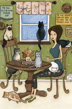 a woman sitting at a table with cats and kittens around her, in front of a window