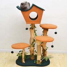 a cat sitting on top of a tree house with four stools in front of it