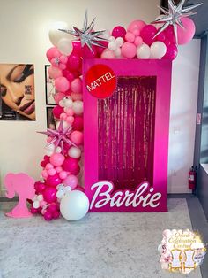 the entrance to barbie's birthday party is decorated with pink and white balloons, star shaped