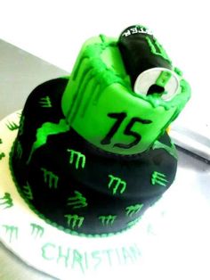 a green and black cake with numbers on it