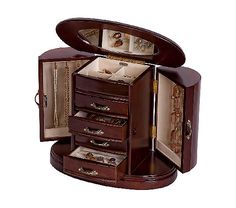 an open wooden jewelry box with drawers