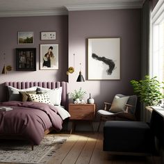 a bed room with a neatly made bed next to a chair and pictures on the wall