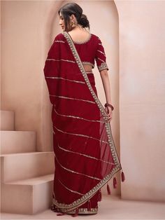 Maroon and gold-toned sareeEmbellished embroidered saree with embroidered border borderHas sequinned detailThe saree comes with an unstitched blouse pieceThe blouse worn by the model might be for modelling purpose only. Check the image of the blouse piece to understand how the actual blouse piece looks like. Golden Blouse, Saree Sale, Golden Border, Embroidered Saree, Embroidered Border, Ethnic Dress, Organza Saree, Blue Paisley, Georgette Sarees