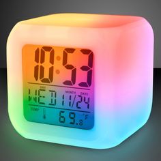 an alarm clock with the time displayed on it's face and multicolored light