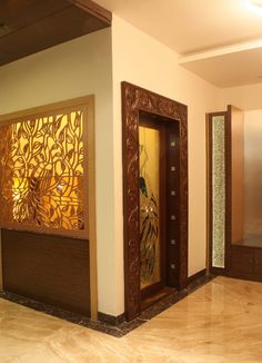 an empty room with wooden doors and decorative panels on the walls, along with marble flooring