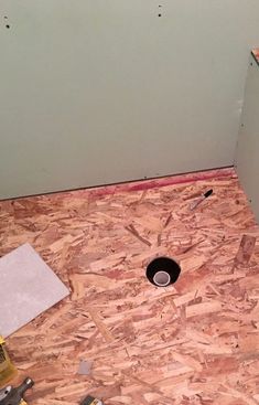 an unfinished bathroom with the floor being installed