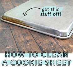 a cookie sheet sitting on top of a wooden table with the words how to clean a cookie sheet