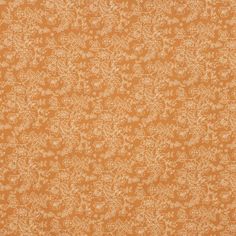 an orange and white wallpaper with small floral designs on it's surface,