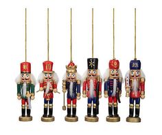 four wooden nutcrackers are hanging from strings