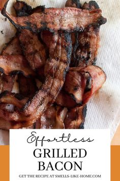 grilled bacon sitting on top of a white paper towel next to an orange border