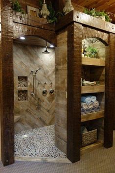 a walk in shower sitting inside of a bathroom next to a tiled floor and walls