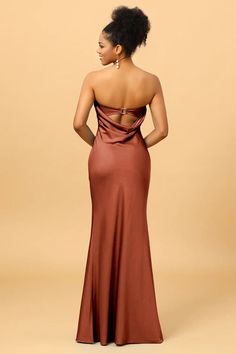 the back of a woman in a brown dress